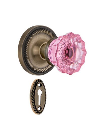 Rope Rosette Mortise Lock Set with Colored Fluted Crystal Glass Knobs Pink in Antique Brass.